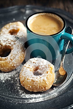 Donuts and cup of coffee.