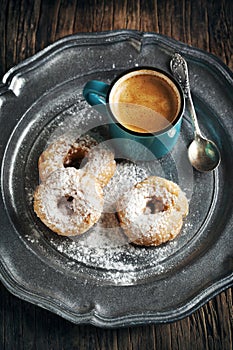 Donuts and cup of coffee.