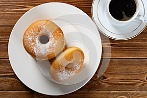 donuts with cup of coffee horizontal composition