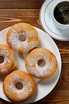 donuts with cup of coffee horizontal composition