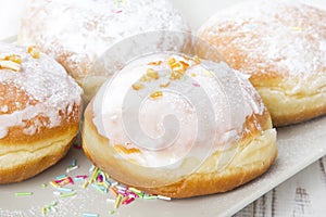 Donuts with frosting and powdered sugar