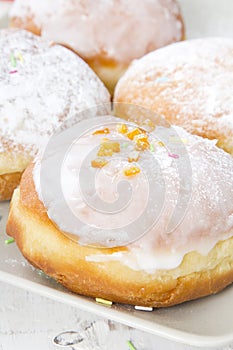 Donuts with frosting and powdered sugar