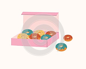 Donuts glazed with colorful sugar and topped with sprinkles lying in pink carton box and isolated on white background.