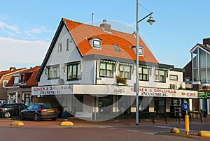 Donuts and Grill House and autos near it in Zwanenburg