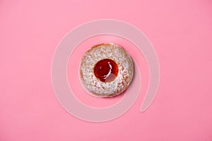 Donuts with icing on pastel pink background. Sweet donuts