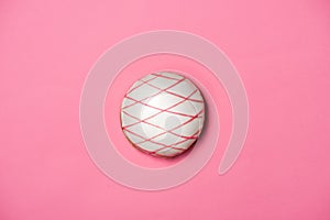 Donuts with icing on pastel pink background. Sweet donuts.