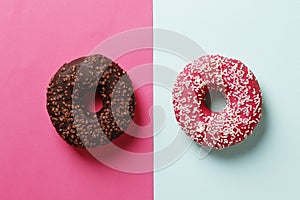 Donuts with icing on pink background. Sweet donuts. Donuts background .