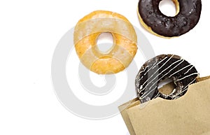 Donuts in a paper bag isolated on a white background