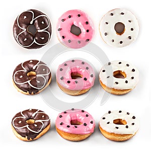 Donuts set isolated on white background. Different type of donuts: with chocolate, with pink and vanilla cream