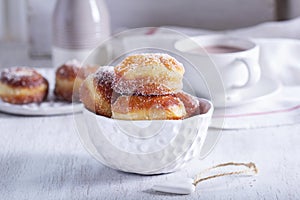 Donuts with sugar and cinnamon served with cocoa. Traditional dessert for Carnival.