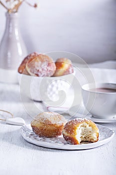 Donuts with sugar and cinnamon served with cocoa. Traditional dessert for Carnival.