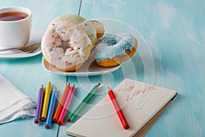 Donuts on table with sketchbook