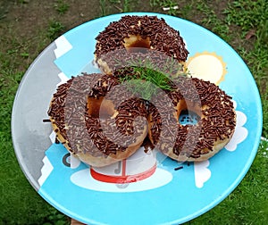 Donuts with a very sweet chocolate meses topping photo