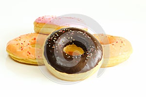 Donuts on white table background.