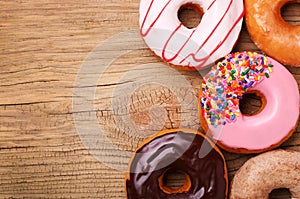 Donuts on wooden background photo
