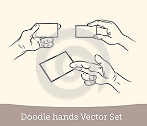 Doodle hand holding a business card set isolated on white background. Vector