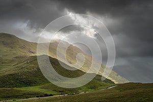 Doolough Valley, Glenummera and Glencullin mountain ranges illuminated by sunlight, Ireland