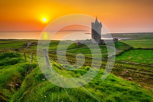 Doonagore castle at the Atlantic Ocean in Doolin, Co. Clare, Ireland
