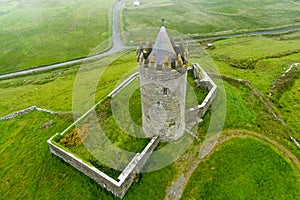 Doonagore Castle, round 16th-century tower house with a small walled enclosure located near the coastal village of Doolin in