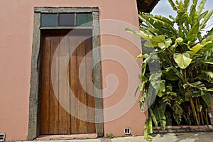 Door with antique wooden rustic jamb