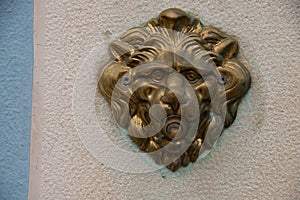 Door bell with a lion`s head, antiqued burnished brass button.