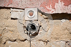 Door bell on a ruined wall