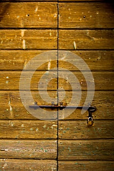 door of boards with padlock background