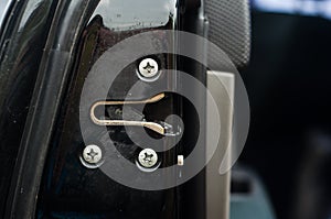 Door closing lock in a black modern car