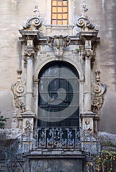 Door decorated in Italian Barocco style photo