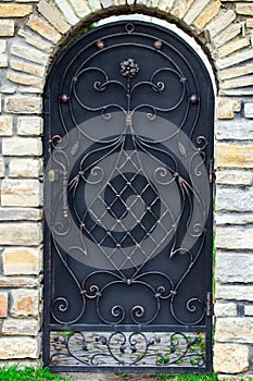 Door decoration with ornate wrought-iron elements, close up
