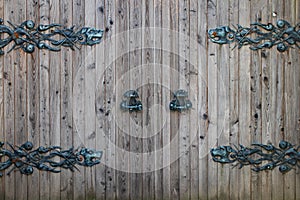 Door decoration with ornate wrought-iron elements, close up