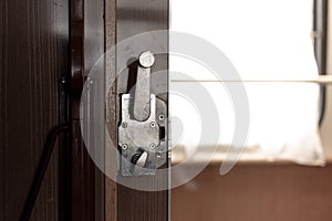 Door and doorknob in a train compartment. Travel by train.