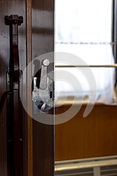 Door and doorknob in a train compartment. Travel by train.