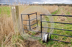 Door in a fence for hikers