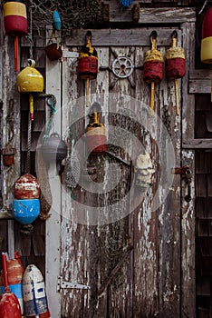 Door with fishnets and lobster buoys