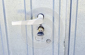 Door handle and built-in lock, with key, on iron door