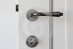 Door with handle and key in the lock