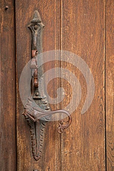 Door handle of an old historical building made of iron
