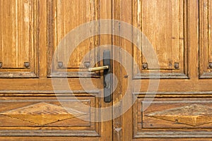 Door handle and old wooden door