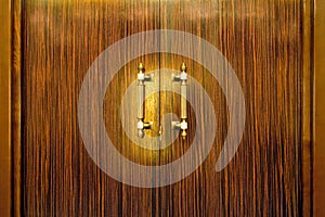 Door handle on the wooden doors