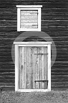 Door And Hatch On A Wooden Wall