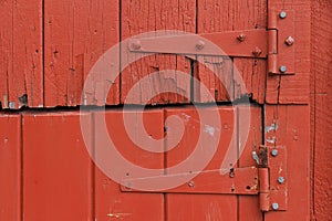 Door Hinges on Old Rustic Red Wooden Door