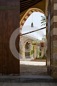 Door of historic Mamluk era Amir Aqsunqur Mosque, Blue Mosque, reveling courtyard, Cairo, Egypt photo