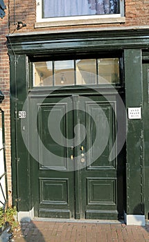 door of the house of Anna Frank the Jewish girl who lived in Ams photo