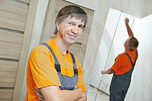 Door installation carpenter worker