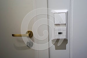 Door key and handle wooden door for lock and access with light switch and temperature control panel