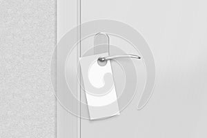Door knob with blank flyer mock up. Empty white flier mockup photo