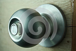 Door knob on unpainted Wooden Door