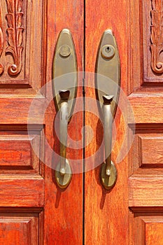 Door knobs as background wooden brown.