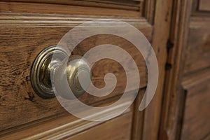 door knocker in bronce hand photo